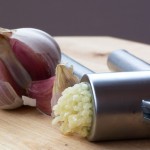 Photo of garlic and garlic press