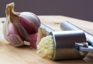 Photo of garlic and garlic press