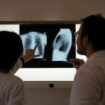 Photo of doctors looking at an x-ray