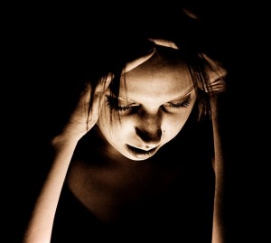 Woman suffering a migraine