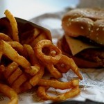 Photo of a burger and curly fries