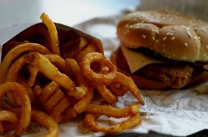Photo of a burger and curly fries