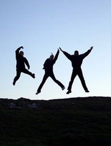 Photo of men jumping for joy
