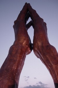 Photo of praying hands sculpture