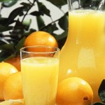 Photo of orange juice and oranges