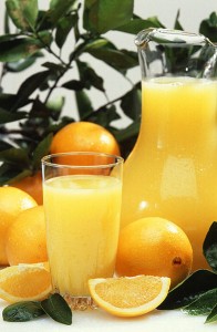 Photo of orange juice and oranges