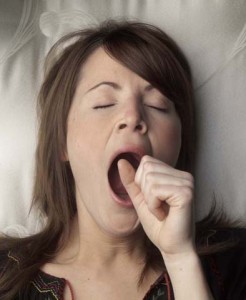 Photo of a woman yawning