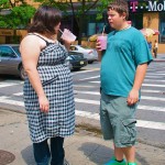 Photo of overweight teenagers with milkshakes