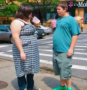 Photo of overweight teenagers with milkshakes