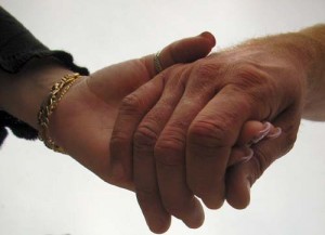 Photo of couple holding hands