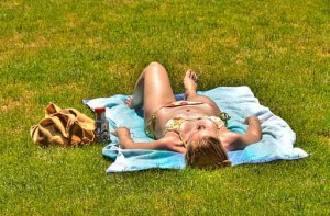 Photo of a woman lying in the sun