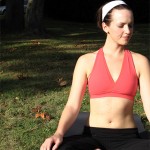Photo of a woman meditating in a park