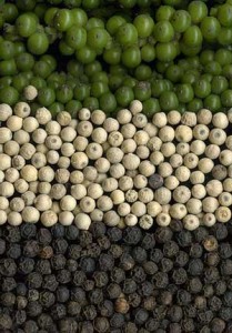 Photo of green, white and black peppercorns