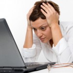Photo of a woman stressed outo by email overload