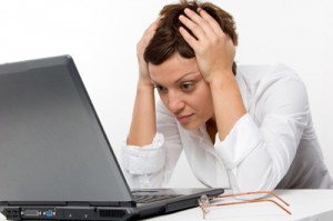 Photo of a woman stressed outo by email overload