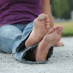 Photo of barefeet with sand on them