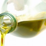 Photo of olive oil being poured from a bottle