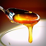 Photo of honey dripping from a spoon