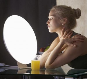 Photo of a woman sitting in front of a light box