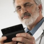 Photo of a doctor using a mobile phone to tweet