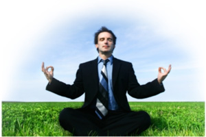 Photo of a man meditating on the grass