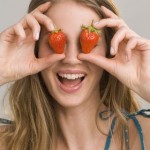 Photo of a happy woman with strawberries