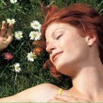 Photo of a woman sleeping in a field of flowers