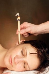 Photo of a woman receiving ear candling treatment