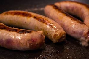 Photo of sausages in a frying pan