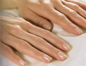 Photo of a woman's hands with well manicured nails