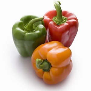 Photo of red, green and yellow peppers