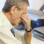 Photo of a tired man at work