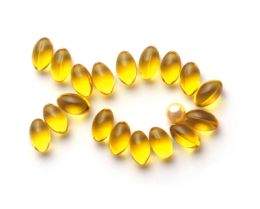 Photo of vitamin capsules in the shape of a fish