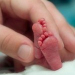 Photo showing scale of a premature baby's feet