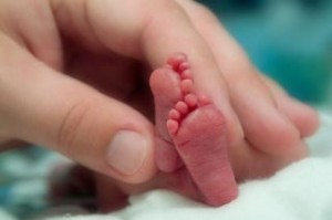 Photo showing scale of a premature baby's feet