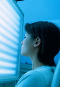 Photo of a woman using light therapy