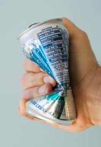 Photo of a hand crushing a diet soda can