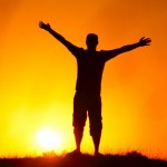 Photo of a man in silhouette against the sun