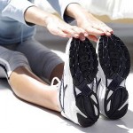 Photo of a woman stretching her calves