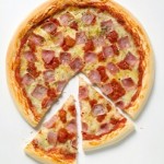 Photo of a ham and cheese pizza