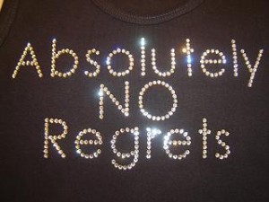 Photo of a t-shirt with "Absolutely No Regrets" spelled out on it in lights