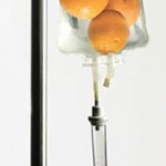 Photo illustrating IV vitamin C by showing oranges in an IV bag