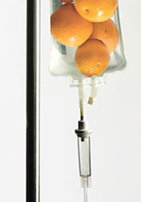 Photo illustrating IV vitamin C by showing oranges in an IV bag
