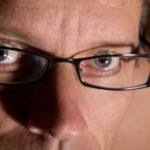 Close up photo of a man wearing glasses