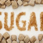 Photo of the word 'sugar' spelled out in granulated sugar
