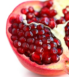 Photo of a pomegranate with seeds exposed