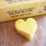 Photo of a pat of butter in the shape of a heart