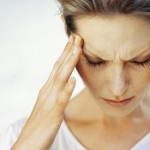 Photo of a woman with a migraine