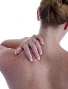 Photo of a women massaging her own neck