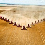 Photo of a monoculture field being harvested